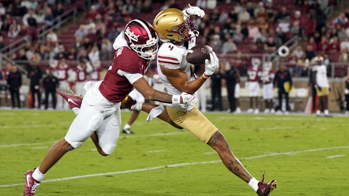 Sep 13, 2025; Stanford, California, USA; Boston College Eagles wide receiver Reed Harris (right) catches a pass against Stanford Cardinal cornerback Cam Richardson (left) during the second quarter at Stanford Stadium. Mandatory Credit: Darren Yamashita-Imagn Images