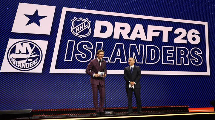 Jun 26, 2026; Buffalo, New York, USA; New York Islanders player Matthew Schaefer announces the thirteenth pick in the first round of the 2026 NHL Draft in front of NHL commissioner Gary Bettman at KeyBank Center. Mandatory Credit: Timothy T. Ludwig-Imagn Images