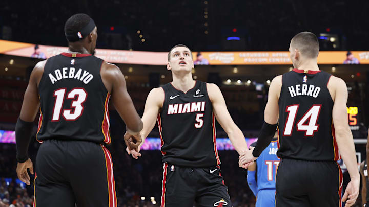 Feb 12, 2025; Oklahoma City, Oklahoma, USA; Miami Heat forward Nikola Jovic (5) celebrates with teammates center Bam Adebayo (13) and guard Tyler Herro (14) after a play against the Oklahoma City Thunder during the second quarter at Paycom Center. Mandatory Credit: Alonzo Adams-Imagn Images Feb 12, 2025; Oklahoma City, Oklahoma, USA; Miami Heat forward Nikola Jovic (5) celebrates with teammates center Bam Adebayo (13) and guard Tyler Herro (14) after a play against the Oklahoma City Thunder during the second quarter at Paycom Center. Mandatory Credit: Alonzo Adams-Imagn Images