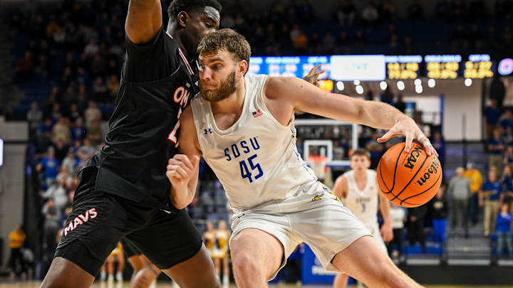 South Dakota State Jackrabbits center Oscar Cluff (45) posts up against Omaha Mavericks forward Valentino Simon (21)