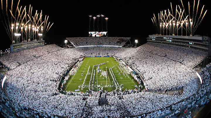 Fireworks burst overhead as the Penn State Nittany Lions take the field