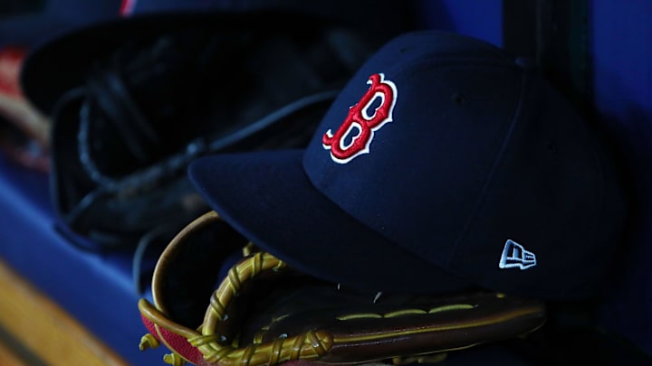 Jul 22, 2019; St. Petersburg, FL, USA; A detail view of Boston Red Sox hat and glove laying in the dugout at Tropicana Field. Mandatory Credit: Kim Klement-Imagn Images Jul 22, 2019; St. Petersburg, FL, USA; A detail view of Boston Red Sox hat and glove laying in the dugout at Tropicana Field. Mandatory Credit: Kim Klement-Imagn Images