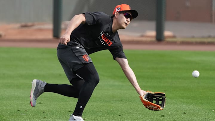 Feb 13, 2025; Scottsdale, AZ, USA; San Francisco Giants outfielder Jung Hoo Lee (51) catches fly balls during spring training camp. Feb 13, 2025; Scottsdale, AZ, USA; San Francisco Giants outfielder Jung Hoo Lee (51) catches fly balls during spring training camp.