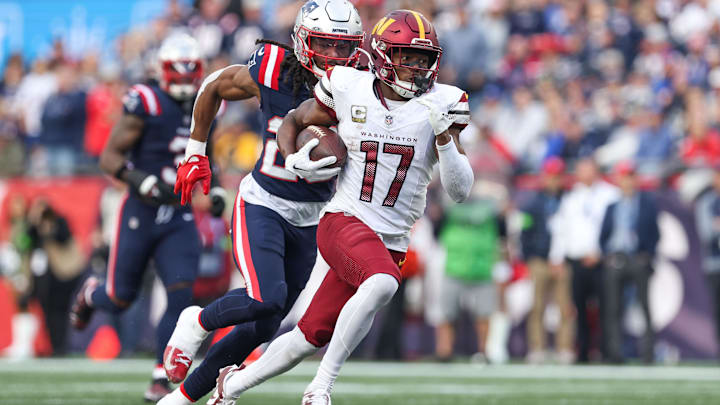 Nov 5, 2023; Foxborough, Massachusetts, USA; Washington Commanders receiver Terry McLaurin (17) runs the ball during the second half against the New England Patriots at Gillette Stadium. Mandatory Credit: Paul Rutherford-Imagn Images