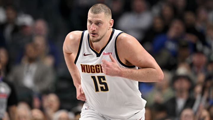 Jan 12, 2025; Dallas, Texas, USA; Denver Nuggets center Nikola Jokic (15) runs back up the court during the second quarter against the Dallas Mavericks at the American Airlines Center. Mandatory Credit: Jerome Miron-Imagn Images