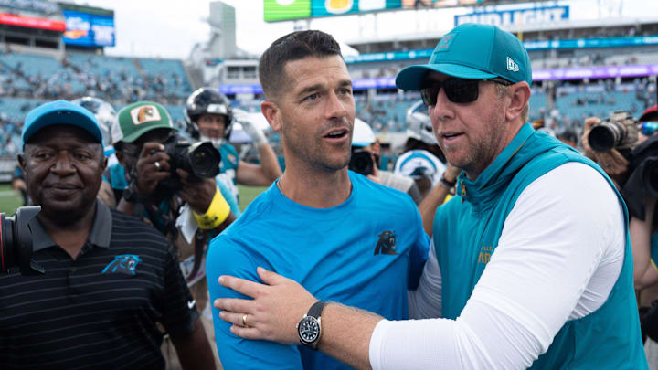 Carolina Panthers head coach Dave Canales and Carolina Panthers head coach Liam Coen met at the center of the field after the game between the Carolina Panthers at Jacksonville Jaguars at EverBank Stadium Sunday September 7, 2025. Jaguars defeated the Panthers 26-10. [Doug Engle/Florida Times-Union]