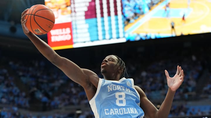 Dec 30, 2025; Chapel Hill, North Carolina, USA; North Carolina Tar Heels forward Caleb Wilson (8) grabs a rebound in the first half at Dean E. Smith Center. Mandatory Credit: Bob Donnan-Imagn Images