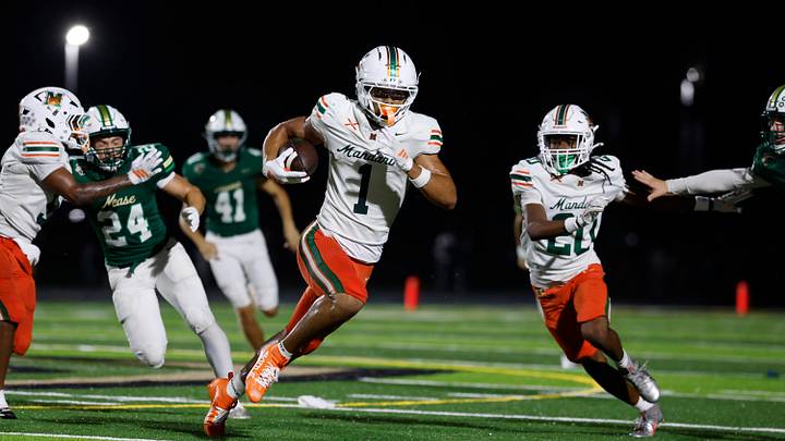 Mandarin’s Brysen Wright (1) rushes for yards during the first quarter of a high school football matchup at Nease High School on Friday, Sept. 11, 2026, in Ponte Vedra Beach, Fla. Mandarin defeated Nease 32-14.