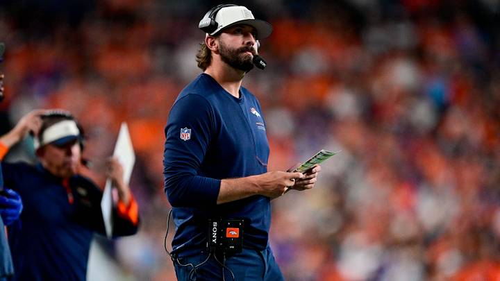 DENVER, CO - AUGUST 21: Denver Broncos offensive coordinator Davis Webb and head coach Sean Payton have a word as players warm up before a preseason game between the Green Bay Packers and the Denver Broncos at Empower Field at Mile High on August 21, 2026 in Denver, Colorado. 