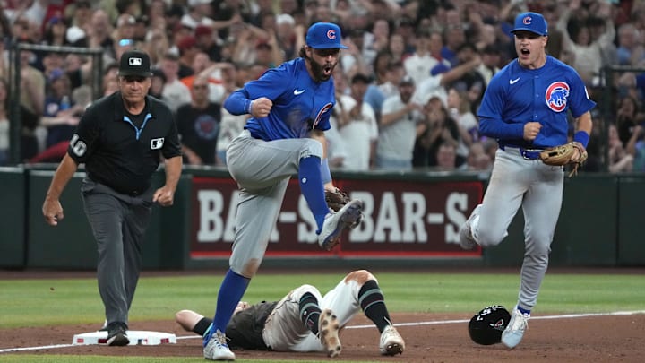 Mar 29, 2025; Phoenix, Arizona, USA; Chicago Cubs shortstop Dansby Swanson (7) and Chicago Cubs second base Matt Shaw (6) celebrates after tagging out Arizona Diamondbacks' Garrett Hampson (8) at thirdbase to end the game in the ninth inning at Chase Field. Mandatory Credit: Rick Scuteri-Imagn Images Mar 29, 2025; Phoenix, Arizona, USA; Chicago Cubs shortstop Dansby Swanson (7) and Chicago Cubs second base Matt Shaw (6) celebrates after tagging out Arizona Diamondbacks' Garrett Hampson (8) at thirdbase to end the game in the ninth inning at Chase Field. Mandatory Credit: Rick Scuteri-Imagn Images