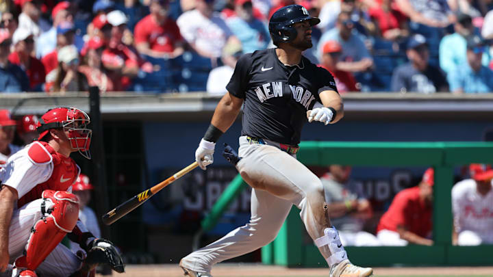 Mar 19, 2025; Clearwater, Florida, USA; New York Yankees outfielder Jasson Dominguez (24) hits a RBI single during the third inning against the Philadelphia Phillies at BayCare Ballpark.