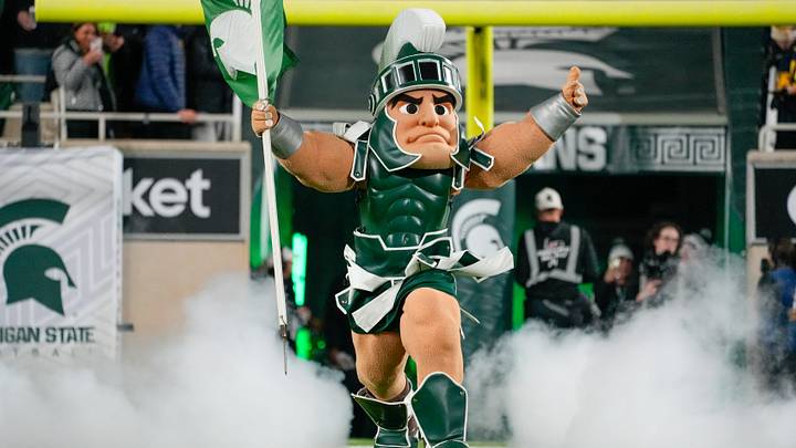 Oct 25, 2025; East Lansing, Michigan, USA; Sparty leads the Michigan State Spartans onto the field prior at a game against the Michigan Wolverines Spartan Stadium. Mandatory Credit: Brendan Mullin-Imagn Images Oct 25, 2025; East Lansing, Michigan, USA; Sparty leads the Michigan State Spartans onto the field prior at a game against the Michigan Wolverines Spartan Stadium. Mandatory Credit: Brendan Mullin-Imagn Images