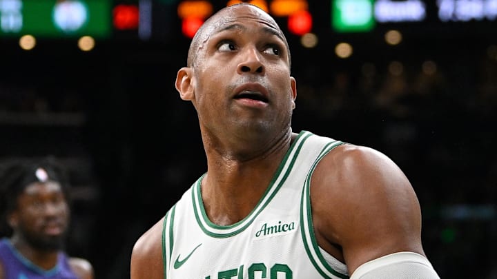 Boston Celtics center Al Horford (42) looks to shoot through the defense of Charlotte Hornets forward Tidjane Salaun (31) during the first half at TD Garden.