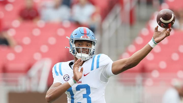 Nov 2, 2024; Fayetteville, Arkansas, USA; Ole Miss Rebels quarterback Austin Simmons (13) during the fourth quarter against the Arkansas Razorbacks at Donald W. Reynolds Razorback Stadium. Mississippi won 63-31. Mandatory Credit: Nelson Chenault-Imagn Images