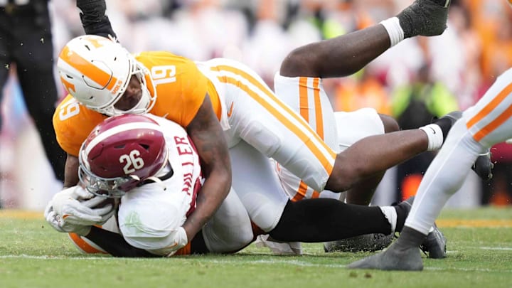Tennessee defensive lineman Joshua Josephs (19) tackles Alabama running back Jam Miller (26) during a game between Tennessee and Alabama at Neyland Stadium in Knoxville, Tenn., Saturday, Oct. 19, 2024.