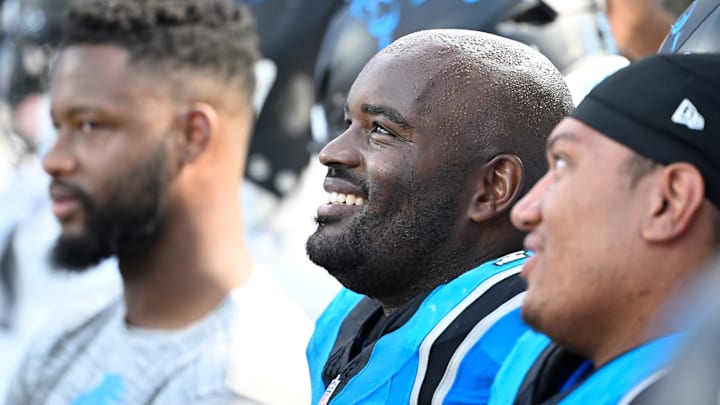 Sep 21, 2025; Charlotte, North Carolina, USA; Carolina Panthers offensive tackle Taylor Moton (72) on the sidelines in the fourth quarter at Bank of America Stadium.