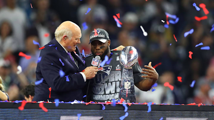 Feb 5, 2017; Houston, TX, USA; New England Patriots running back James White (right) is interviewed by Terry Bradshaw as celebrates with the Vince Lombardi trophy after defeating the Atlanta Falcons during Super Bowl LI at NRG Stadium. Mandatory Credit: Mark J. Rebilas-Imagn Images
