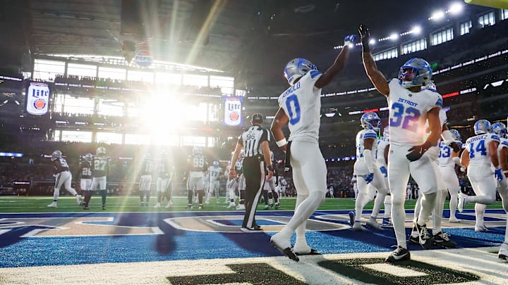 Detroit’s Terrion Arnold and Brian Branch celebrate after a turnover. 