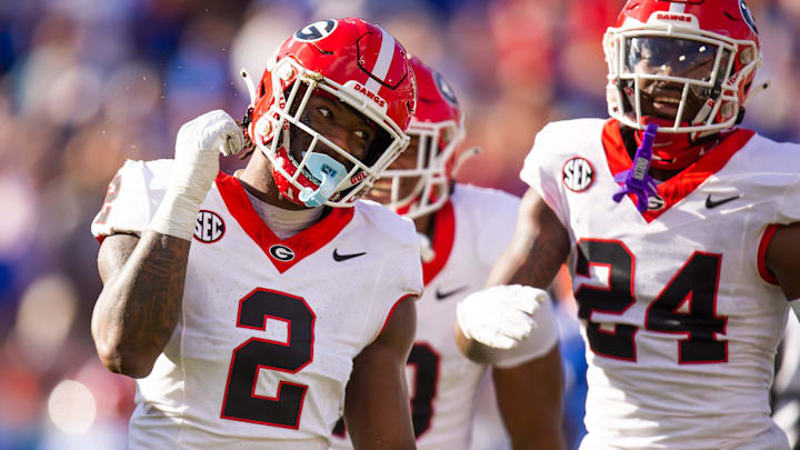 Georgia Bulldogs linebacker Smael Mondon Jr. (2) celebrates his tackle of Florida Gators running back Trevor Etienne (7) at Everbank Stadium in Jacksonville, FL on Saturday, October 28, 2023. [Doug Engle/Gainesville Sun]