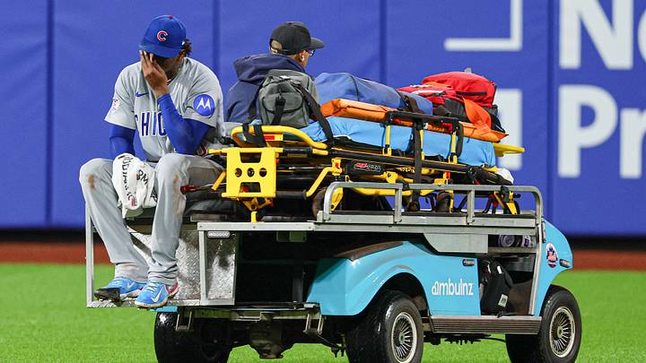 Jun 23, 2026; New York City, New York, USA; Chicago Cubs pitcher Edward Cabrera (30) is driven off the field after an injury at first base during the fifth inning against the New York Mets at Citi Field. Mandatory Credit: Vincent Carchietta-Imagn Images