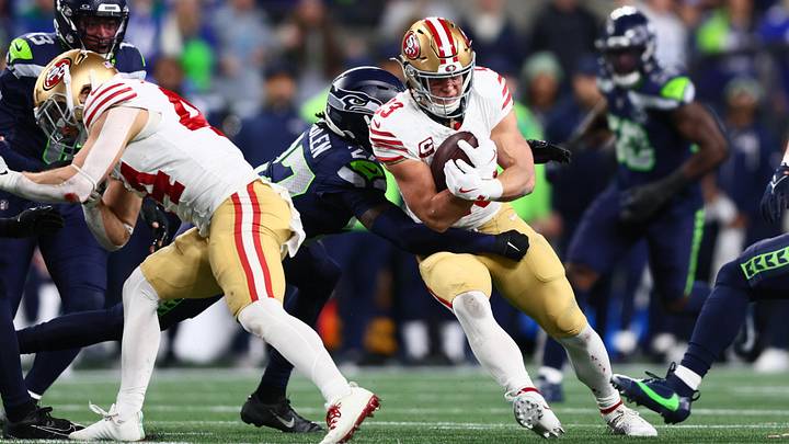 Jan 17, 2026; Seattle, WA, USA; San Francisco 49ers running back Christian McCaffrey (23) is tackled b y. Seattle Seahawks cornerback Riq Woolen (27) during the first half in an NFC Divisional Round game at Lumen Field. Mandatory Credit: Kevin Ng-Imagn Images Jan 17, 2026; Seattle, WA, USA; San Francisco 49ers running back Christian McCaffrey (23) is tackled b y. Seattle Seahawks cornerback Riq Woolen (27) during the first half in an NFC Divisional Round game at Lumen Field. Mandatory Credit: Kevin Ng-Imagn Images