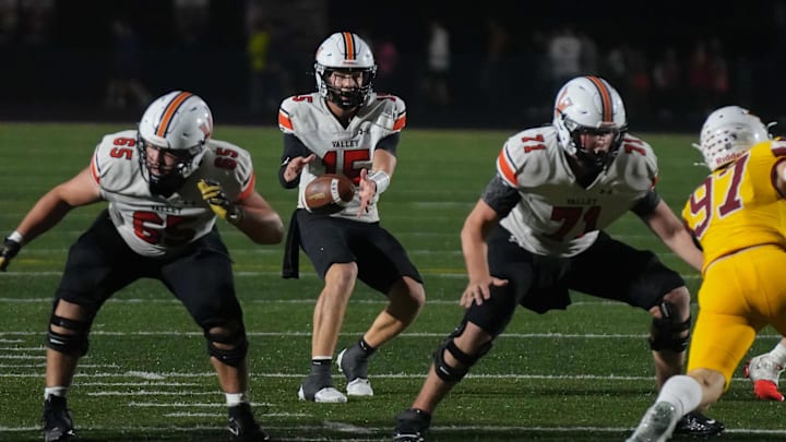 West Des Moines Valley quarterback Drake DeGroote takes the snap against Ankeny during a high school football game Oct 17, 2025, at Ankeny Stadium in Ankeny. Mandatory Credit: Bryon Houlgrave-The Des Moines Register