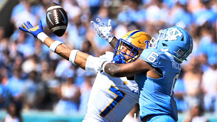 Oct 5, 2024; Chapel Hill, North Carolina, USA; Pittsburgh Panthers defensive back Javon McIntyre (7) breaks up a pass intended for North Carolina Tar Heels wide receiver Nate McCollum (6) in the first quarter at Kenan Memorial Stadium. Mandatory Credit: Bob Donnan-Imagn Images