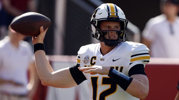 Oct 26, 2024; Tuscaloosa, Alabama, USA; Missouri Tigers quarterback Brady Cook (12) warms up at Bryant-Denny Stadium. Mandatory Credit: Butch Dill-Imagn Images Oct 26, 2024; Tuscaloosa, Alabama, USA; Missouri Tigers quarterback Brady Cook (12) warms up at Bryant-Denny Stadium. Mandatory Credit: Butch Dill-Imagn Images