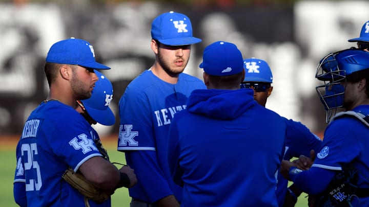 Kentucky head coach Nick Mingione talks with pitcher Mason Hazelwood at a conference during their game against Louisville at Jim Patterson Stadium, Tuesday, Apr. 2, 2019 in Louisville Ky.

Kyloubaseball Tde010