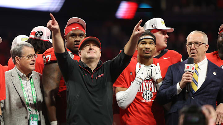 Dec 7, 2024; Atlanta, GA, USA; Georgia Bulldogs head coach Kirby Smart reacts after defeating the Texas Longhorns in overtime in the 2024 SEC Championship game at Mercedes-Benz Stadium. Mandatory Credit: Brett Davis-Imagn Images Dec 7, 2024; Atlanta, GA, USA; Georgia Bulldogs head coach Kirby Smart reacts after defeating the Texas Longhorns in overtime in the 2024 SEC Championship game at Mercedes-Benz Stadium. Mandatory Credit: Brett Davis-Imagn Images