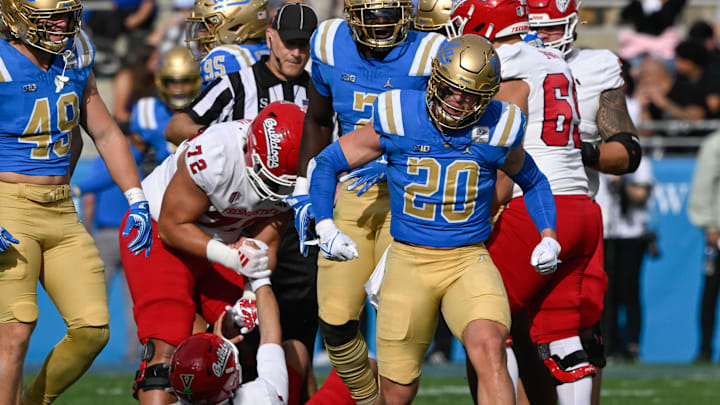 Nov 30, 2024; Pasadena, California, USA; UCLA Bruins linebacker Kain Medrano (20) celebrates sacking Fresno State Bulldogs quarterback Mikey Keene (1) during the section quarter at Rose Bowl. Mandatory Credit: Robert Hanashiro-Imagn Images