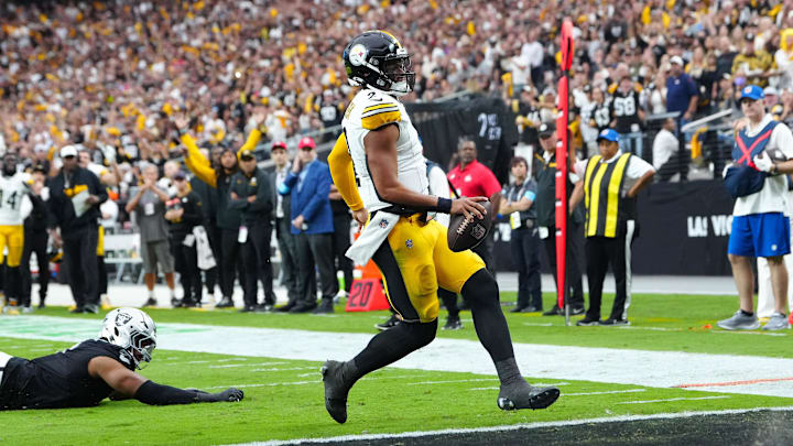 Oct 13, 2024; Paradise, Nevada, USA; Pittsburgh Steelers quarterback Justin Fields (2) scores a rushing touchdown against the Las Vegas Raiders during the second quarter at Allegiant Stadium. Mandatory Credit: Stephen R. Sylvanie-Imagn Images Oct 13, 2024; Paradise, Nevada, USA; Pittsburgh Steelers quarterback Justin Fields (2) scores a rushing touchdown against the Las Vegas Raiders during the second quarter at Allegiant Stadium. Mandatory Credit: Stephen R. Sylvanie-Imagn Images