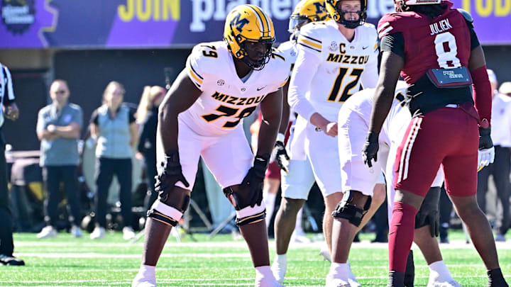 Oct 12, 2024; Amherst, Massachusetts, USA; Missouri Tigers offensive lineman Armand Membou (79) lines up against the Massachusetts Minutemen during the first half at Warren McGuirk Alumni Stadium. Mandatory Credit: Eric Canha-Imagn Images Oct 12, 2024; Amherst, Massachusetts, USA; Missouri Tigers offensive lineman Armand Membou (79) lines up against the Massachusetts Minutemen during the first half at Warren McGuirk Alumni Stadium. Mandatory Credit: Eric Canha-Imagn Images