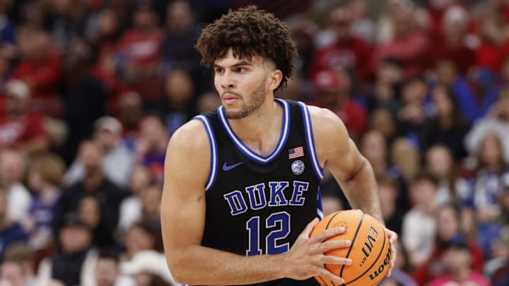 Nov 27, 2025; Chicago, Illinois, USA; Duke Blue Devils forward Cameron Boozer (12) looks to pass the ball against Arkansas Razorbacks during the second half at United Center. Mandatory Credit: Kamil Krzaczynski-Imagn Images