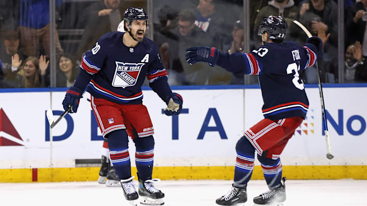 Kreider and Adam Fox celebrate a goal
