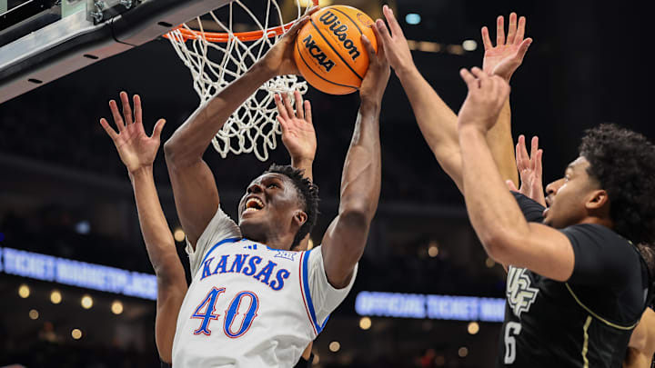 Mar 12, 2025; Kansas City, MO, USA; Kansas Jayhawks forward Flory Bidunga (40) shoots the ball during the first half against the UCF Knights at T-Mobile Center. Mandatory Credit: William Purnell-Imagn Images Mar 12, 2025; Kansas City, MO, USA; Kansas Jayhawks forward Flory Bidunga (40) shoots the ball during the first half against the UCF Knights at T-Mobile Center. Mandatory Credit: William Purnell-Imagn Images
