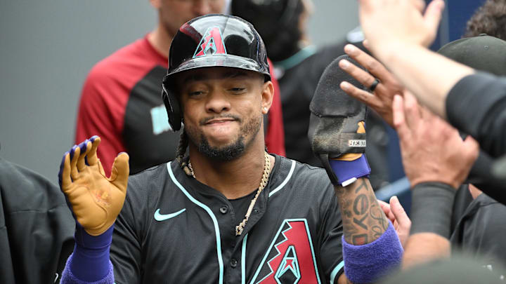 Ketel Marte of Arizona Diamondbacks celebrates with teammates after scoring against Toronto Blue Jays Ketel Marte of Arizona Diamondbacks celebrates with teammates after scoring against Toronto Blue Jays