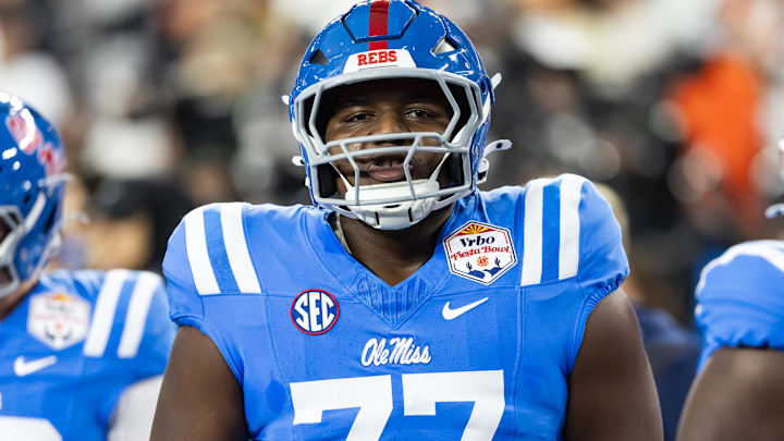 Jan 8, 2026; Glendale, AZ, USA; Mississippi Rebels offensive lineman Ethan Fields (77) against the Miami Hurricanes during the 2026 Fiesta Bowl and semifinal game of the College Football Playoff at State Farm Stadium. Mandatory Credit: Mark J. Rebilas-Imagn Images
