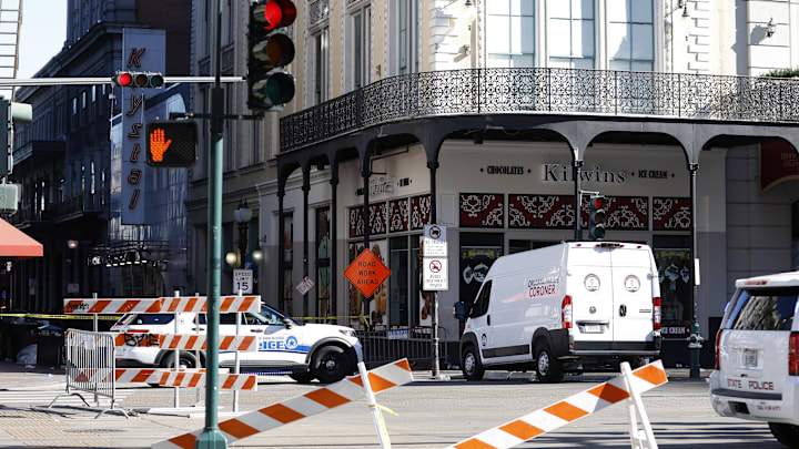 Jan 1, 2025; A view of New Orleans police and coroner's office vehicles blocking off Bourbon Street at Canal Street after the New Year's Eve attack Jan 1, 2025; A view of New Orleans police and coroner's office vehicles blocking off Bourbon Street at Canal Street after the New Year's Eve attack