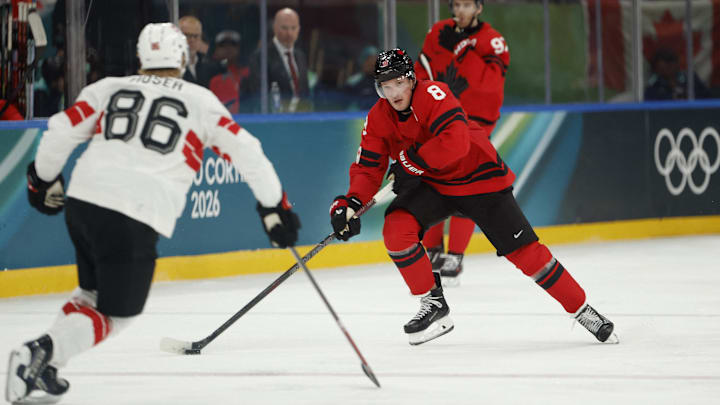 Feb 13, 2026; Milan, Italy; Cale Makar of Canada in action with Janis Moser of Switzerland in men's ice hockey group A play during the Milano Cortina 2026 Olympic Winter Games at Milano Santagiulia Ice Hockey Arena. Mandatory Credit: Geoff Burke-Imagn Images Feb 13, 2026; Milan, Italy; Cale Makar of Canada in action with Janis Moser of Switzerland in men's ice hockey group A play during the Milano Cortina 2026 Olympic Winter Games at Milano Santagiulia Ice Hockey Arena. Mandatory Credit: Geoff Burke-Imagn Images