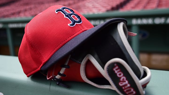 May 18, 2025; Boston, Massachusetts, USA; A Boston Red Sox hat and glove rests on the railing by the dugout prior to a game against the Atlanta Braves at Fenway Park. Mandatory Credit: Bob DeChiara-Imagn Images May 18, 2025; Boston, Massachusetts, USA; A Boston Red Sox hat and glove rests on the railing by the dugout prior to a game against the Atlanta Braves at Fenway Park. Mandatory Credit: Bob DeChiara-Imagn Images