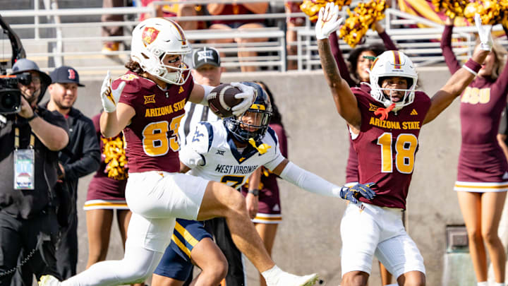 Arizona State Sun Devils Derek Eusebio (83) jumps to score a touchdown against the West Virginia Mountaineers during a game at Mountain America Stadium in Tempe on Nov. 15, 2025.