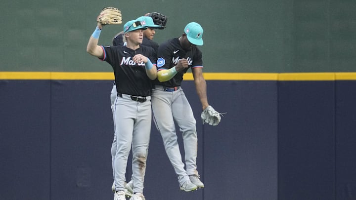 Jul 25, 2025; Milwaukee, Wisconsin, USA; Miami Marlins outfielder Kyle Stowers (28), outfielder Dane Myers (54) and outfielder Jesús Sánchez (7) celebrate a 5-1 win over the Milwaukee Brewers at American Family Field. Mandatory Credit: Michael McLoone-Imagn Images