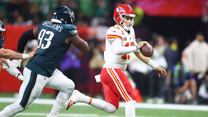 Feb 9, 2025; New Orleans, LA, USA; Kansas City Chiefs quarterback Patrick Mahomes (15) runs away from Philadelphia Eagles defensive tackle Milton Williams (93) in the third quarter in Super Bowl LIX at Ceasars Superdome. Mandatory Credit: Mark J. Rebilas-Imagn Images
