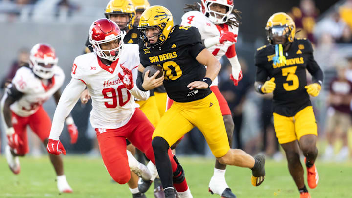 Arizona State Sun Devils quarterback Sam Leavitt (10) runs the ball against Houston Cougars defensive lineman Eddie Walls III (90)