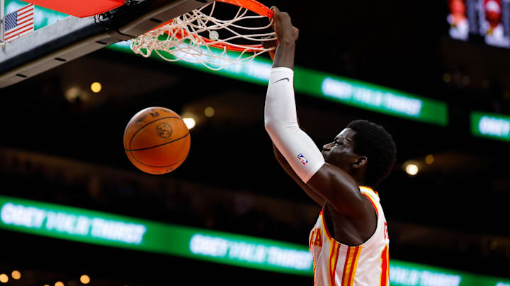 Mouhamed Gueye #18 of the Atlanta Hawks dunks the ball against the Miami Heat.