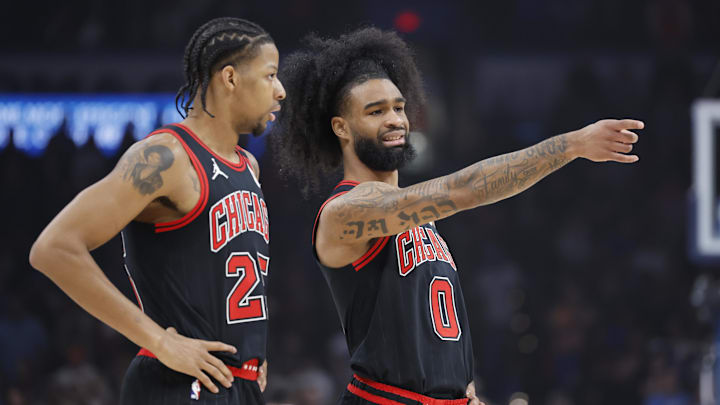 Mar 31, 2025; Oklahoma City, Oklahoma, USA; Chicago Bulls guard Coby White (0) talks to forward Dalen Terry (25) during the first quarter against the Oklahoma City Thunder at Paycom Center. Mandatory Credit: Alonzo Adams-Imagn Images