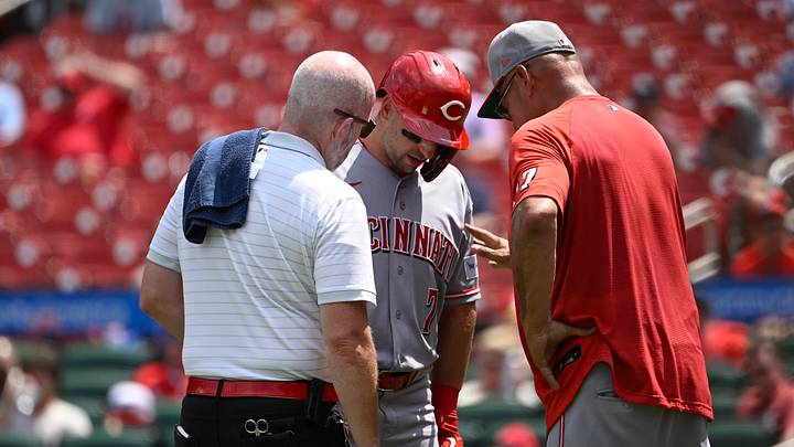 Jul 26, 2026; St. Louis, Missouri, USA; Cincinnati Reds second baseman Spencer Steer (7) is checked on by Cincinnati Reds manager Terry Francona (77) and training staff during a game against the St. Louis Cardinals in the fifth inning at Busch Stadium. Mandatory Credit: Joe Puetz-Imagn Images