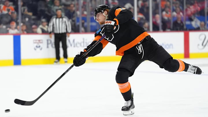 Apr 12, 2025; Philadelphia, Pennsylvania, USA; Philadelphia Flyers right wing Owen Tippett (74) shoots the puck against the New York Islanders in the second period at Wells Fargo Center.