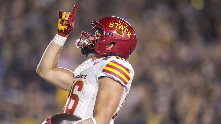 Oct 12, 2024; Morgantown, West Virginia, USA; Iowa State Cyclones running back Carson Hansen (26) runs the ball for a touchdown against the West Virginia Mountaineers during the second quarter at Mountaineer Field at Milan Puskar Stadium. Mandatory Credit: Ben Queen-Imagn Images